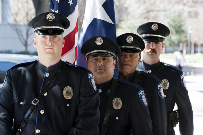 Police Officers at a bench dedication to fallen SMU police officer Mark McCullers