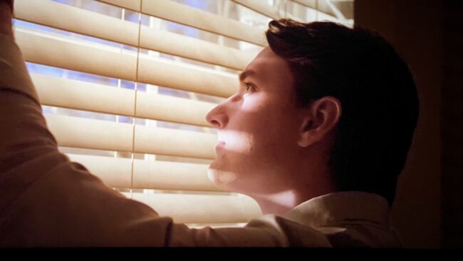 Evan looks out the window at the world around him hours before a meteor hits Earth in Maddox's film.