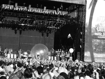 The Flaming Lips steal the show as singer Wayne Coyne  rides on top of the crowd in a giant plastic ball.