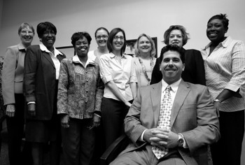 Behrens, seated, with his staff at the Career Center.