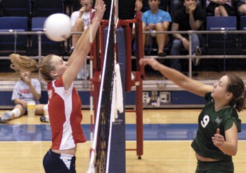 Marshall's Christin Bimberg spikes the ball past SMU's Kara Cornelius  during Sunday afternoon's game.     