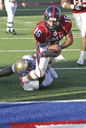 SMU quarterback Justin Willis dives into the endzone for a touchdown during the fourth quarter of Saturday game at Ford Stadium.