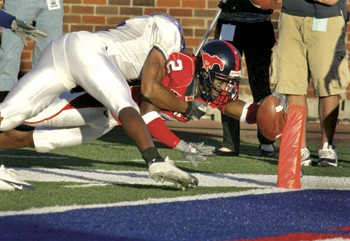 SMUs Blake Warren goes horizontal into the endzone for a touchdown to lock-up SMUs victory over Tulsa on Saturday. The win made the Mustangs bowl eligible, but SMU needs a win over Rice this Saturday to ensure a bowl berth.