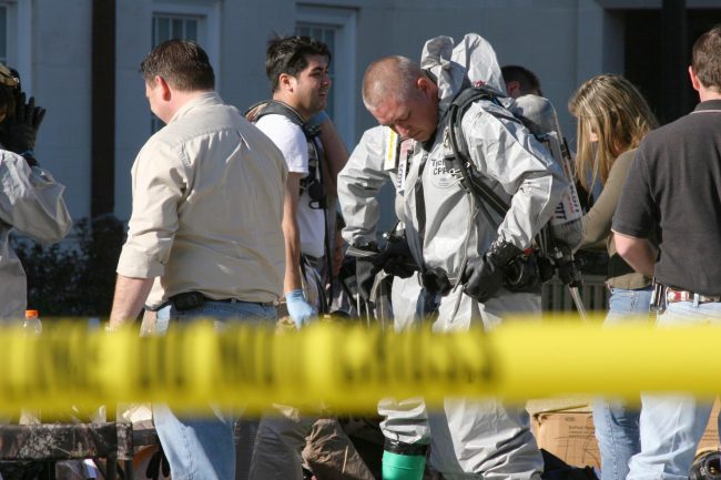 Members of the Garland Health Department Mobile Lab prepare to enter the Laura Lee Blanton Building Friday afternoon.