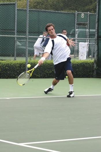 SMUs Federico Murgier takes a swing during the match against UIC yesterday afternoon at the Bent Tree Tennis Club.