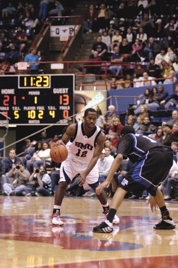 SMU's Jon Killen attempts to get past the Memphis defense during Saturday night's game in Moody.