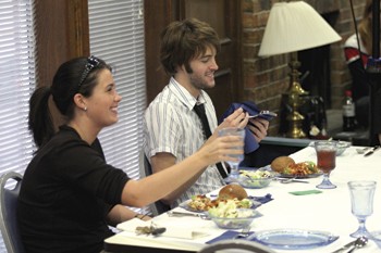 Kathleen McDowell and Matt Haley begin to eat their meal at the Food for Thought banquet Wednesday evening.