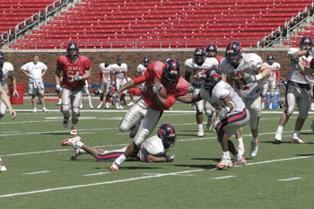 SMUs Chris Butler attempts to make a few yards in the annual Red vs. Blue Game on Saturday in Ford Stadium.