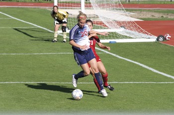 SMU's Kim Peabody tries to get around Arkansas defender during Saturday's spring game at Westscott Field.