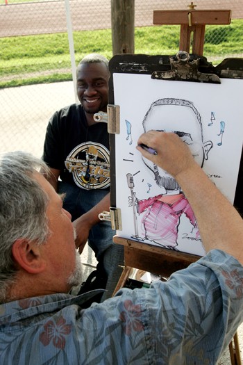 T.K. Stillman gets his portrait drawn at a booth during the 2006 Mane Event.