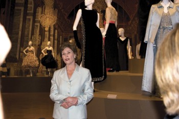 First Lady Laura Bush talks with members of the press during her tour of the Ballenciaga Exhibit at the Meadows Museum on May 26. She lent her 2005 inaugural gown to the exhibition.