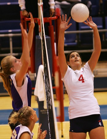 SMUs Stefanie Kons (No. 4) sets the ball as WCUs Kara Lynzee Brooks (back) and Amanda Kerr (front) attempt the block during Friday evenings matchup in Moody.