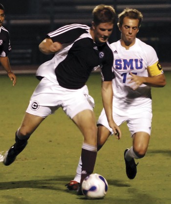 SMUs Scott Corbin (right) goes for the ball against a Centenary defender during a recent game at Westcott Field.