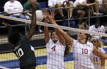 SMUs Stefanie Kons (4) and Natalie Peters (10) attempt to block a Marshall attack. The Mustangs lost the match 3-1 Friday night, and are 0-2 in C-USA after losing 3-2 against East Carolina on Sunday.