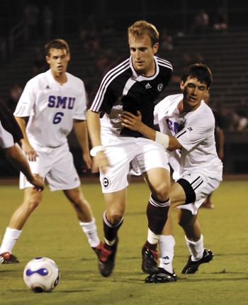 SMUs Gabe Arredondo (right) tries to get past a Centenary defender during Thursday nights game at Westcott Field. The Mustangs beat the Gents 5-1.
