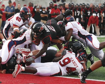 Arkansas State running back Reggie Arnold (No. 2) breaks through the SMU defense for a touchdown during the first quarter of Saturdays game in Jonesboro, Ark.