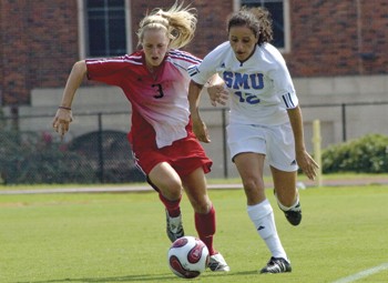 Texas Techs Shannon Sims (left) and SMUs Jennifer Raad (right) dash for the ball during Sunday afternoons game at Westcott Field.