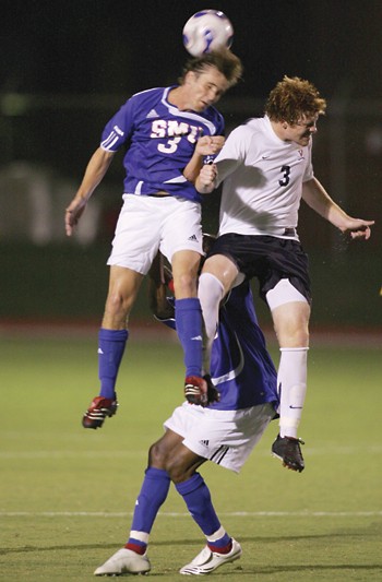 SMU midfielder Jeff Harwell (left) and Virginias Matt Poole (right) jump for the headbutt during Friday nights game at Westcott Field.