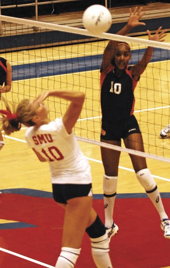 SMUs Natalie Peters (left) attempts to hit the ball past the block of UTSAs Victoria Prior (right) during Tuesday evenings matchup.