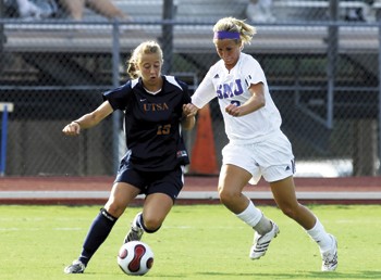 SMUs Kim Peabody (right) goes for the ball against UTSAs Celeste Carruth (left) during Friday evenings game at Westcott Field.