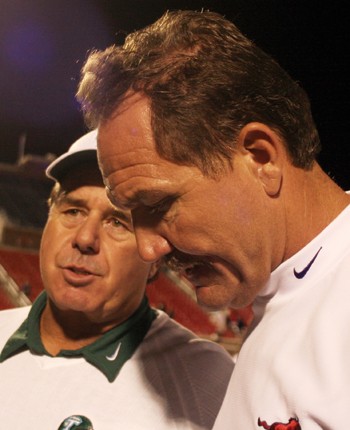 Tulane head coach Bob Toledo (left) talks with SMU head coach Phil Bennett (right) after Saturday nights game.