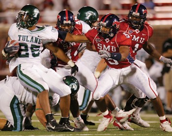 Tulane running back Matt Forte (25) slips past a host of SMU defenders during the fourth quarter of Saturday nights game.