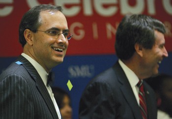 Brent Christopher (left), President and CEO of the Communities Foundation of Texas shares a smile with SMU President R. Gerald Turner (right) after the announcement of a $10.1 million gift to establish the Caruth Institute for Engineering Education and a help fund the construction of a new Caruth Hall.