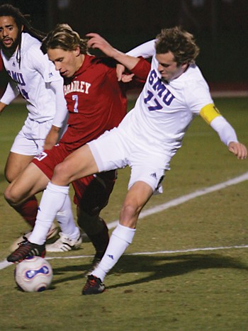 SMU midfielder Scott Corbin (17) and Bradley defender Stephen Brust (7) fight to gain control of the ball in the second half of last nights game at Westcott Field.