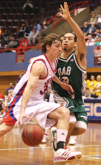 SMUs Ryan Harp takes it to the basket against UAB.
