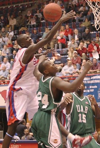 SMUs Bamba Fall keeps the ball alive under the basket against UAB on Saturday.