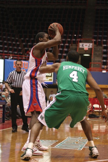 SMU senior guard Derrick Roberts looks for an open SMU player against Marshall.