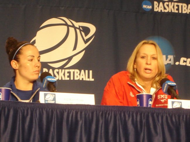 Head coach Rhonda Rompola answers a question during Saturday's media session at Mackey Arena on the Purdue University campus while senior Katy Cobb (left) listens.