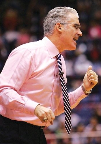SMU mens basketball head coach Matt Doherty positions his defense.