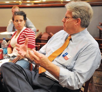 SMU sophomore Rhiannon Hamam listens as Emil Reichstadt, the Democratic candidate running for State Representative in District 108, talks policy. His opponent is Republican Dan Branch.