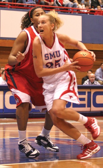 SMUs Janielle Dodds drives the lane against Marshall.