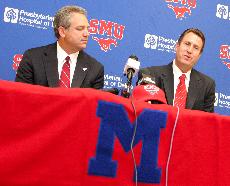 SMU Director of Athletics Steve Orsini (left) listens to new head coach of the mens soccer team Tim McClements (right) answer questions at a press conference July 23 in Dallas. McClements previously was an assistant coach of the team. 