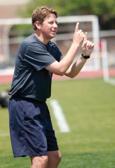 SMUs womens soccer head coach Brent Erwin signals his players against Baylor. Photo by Nick McCarthy, The Daily Campus