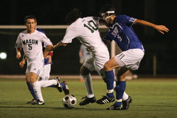 SMU defender Ryan Mirsky tries to stop George Mason forward Irvin Martinez in a 3-0 win Sept. 12 at the Pregos Express Italian Mens Soccer Invitational at Westcott Field.