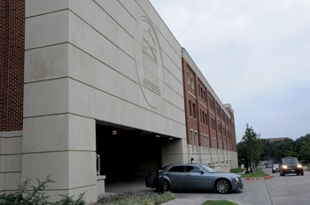 A car pulls out of the newly built Binkley Garage located at the corner of Binkley and Airline.