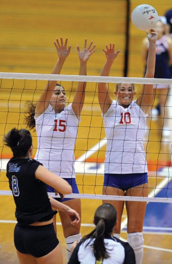 SMU middle blocker Natalie Peters gets a piece of the spike by Tulsas Beth Hodge.