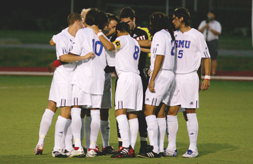 Photo by John Schreiber, The Daily Campus The SMU mens soccer team huddles in center field to discuss their plan of attack during the 2007 season.