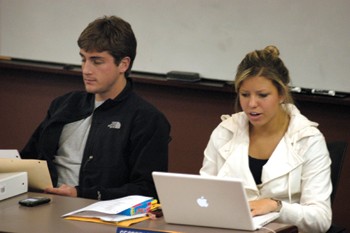 SMU student senate members Kyle Bennett and Erica Briceno begin their meeting on Monday in Hughes-Trigg Student Center.      