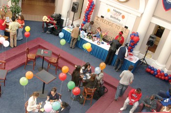 Students, faculty and staff celebrate Hughes-Triggs twenty-first birthday in the Commons Thursday afternoon. The celebration had music, food and give-aways in addition to information about the effects of alcohol.