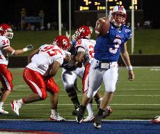 SMU quarterback Bo Levi Mitchell socres on a four-yard touchdown run against Houston at Ford Stadium Saturday night.