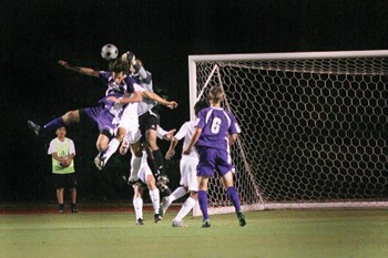 SMU goalkeeper Craig Hill punches the ball away from the goal in Sunday nights match against UCA at Westcott Field. 