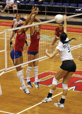 SMUs Jessica Oliver and Natalie Peters go up for a block against Tulanes Sara Radosevic in a 3-0 loss Sunday afternoon in Moody Coliseum. SMU went 1-1 over the weekend, defeating UTEP 3-2 Friday.