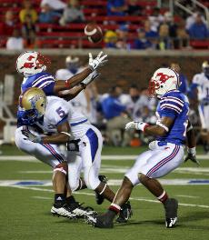 SMUs Brian McCann gets hit attempting to receive a punt in the second quarter against Tulsa at Ford Stadium.