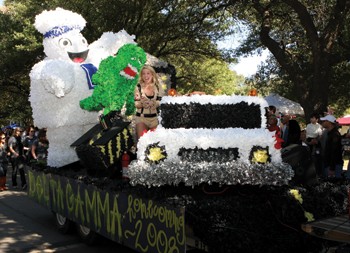 Delta Gammas Katie Clifford throws out candy from the winning Homecoming float. The sorority decided Ghostbusters would fit within the weekends theme, Rolling Out the Red Carpet.