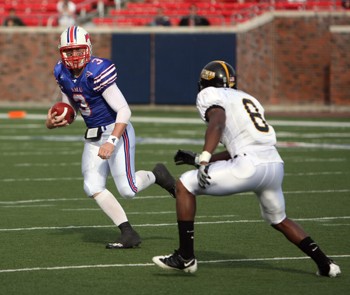 SMU quarterback Bo Levi Mitchell looks for an escape route before getting tackled by Southern Mississippis Justin Wilson in the final game of the season last Saturday at Ford Stadium. The Mustangs finished 1-11 for the second season in a row.