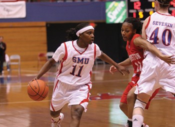 SMU guard LaShandra Hill drives past Houston guard Brittney Scott last night in Moody Colliseum.